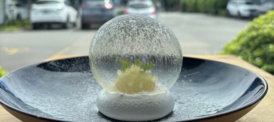 Caramelised pineapple meringue topped with pineapple sorbet, caramelised fruit, pineapple gel, and fresh mint.