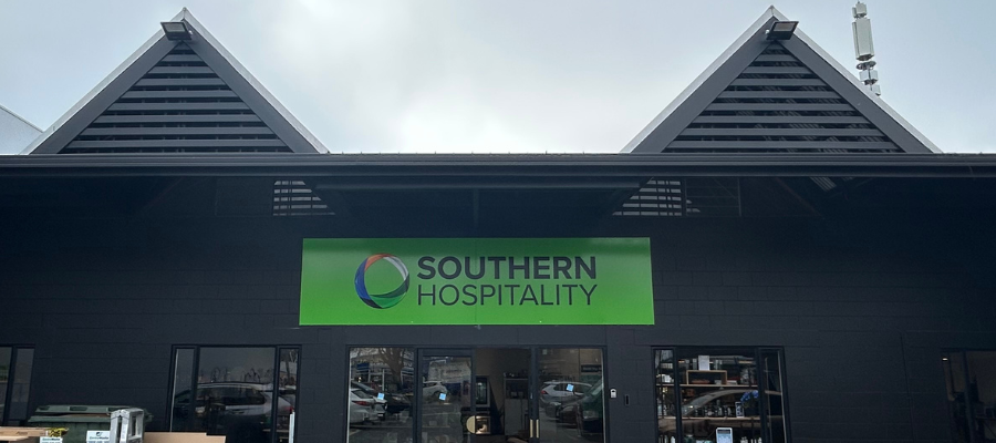 Modern hospitality showroom and demo kitchen in Christchurch featuring commercial kitchen equipment and tabletop displays.